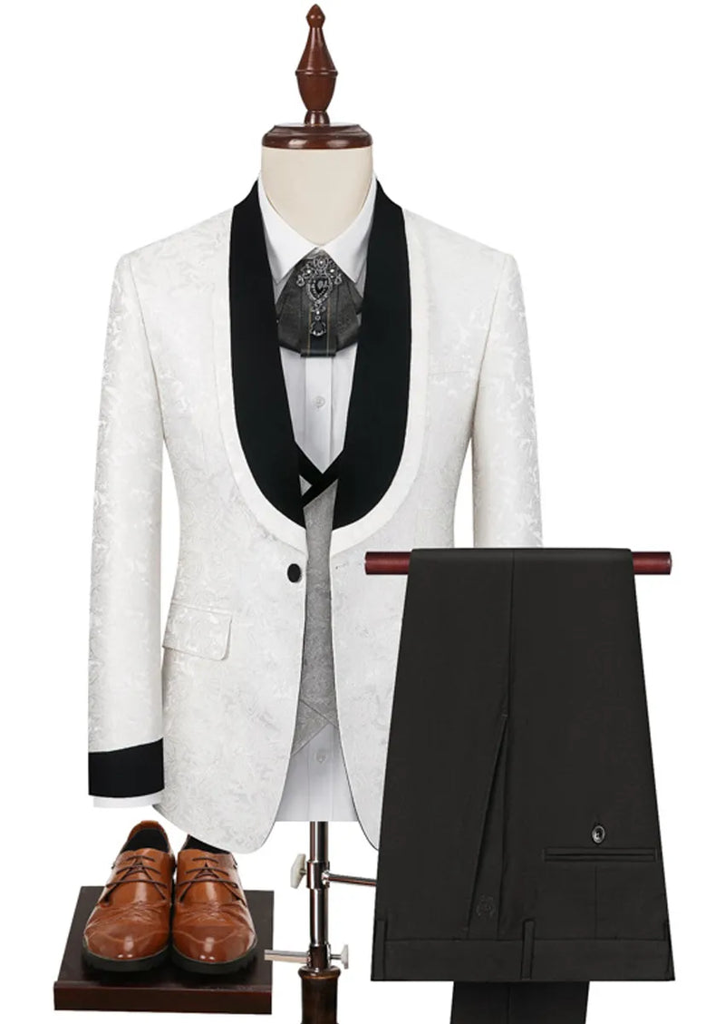 White suit jacket with black lapels on a mannequin, paired with black pants and brown shoes.
