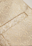 Beige suit with vest and pants on a mannequin against a white background