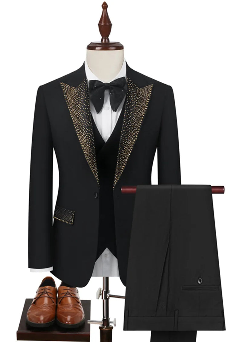 Black tuxedo with gold lapels on a mannequin, accompanied by a bow tie and brown shoes.