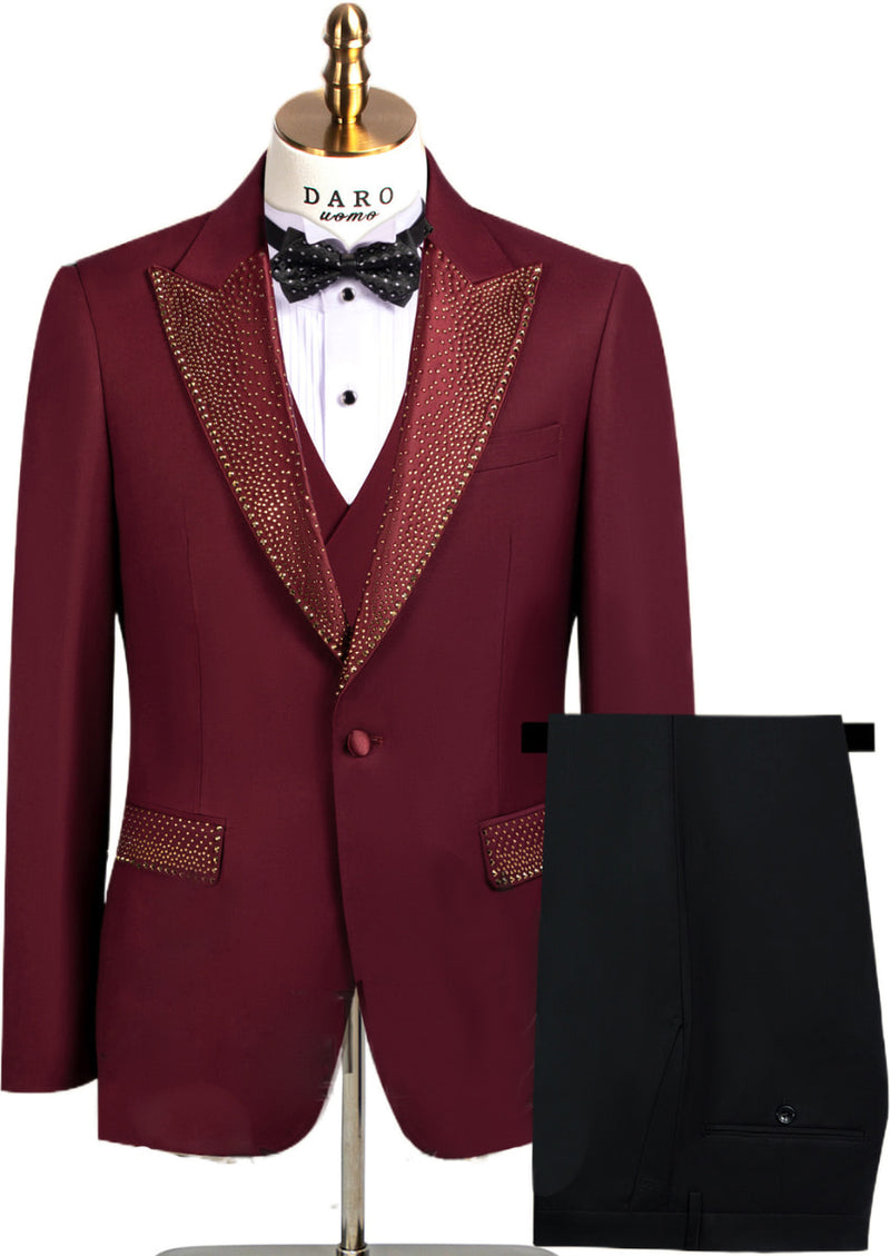 Maroon tuxedo with gold lapels on a mannequin against a white background